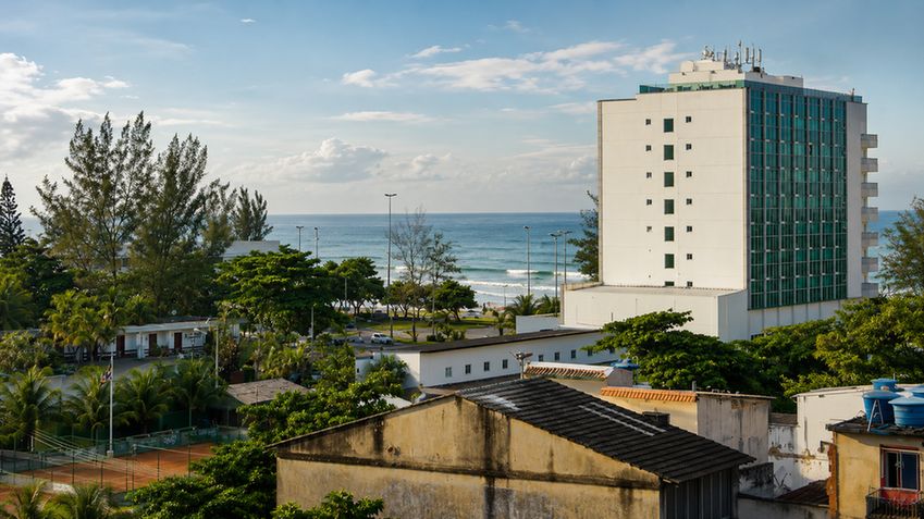 Ocean waves rolling onto golden sand near Recreio dos Bandeirantes, Rio de Janeiro