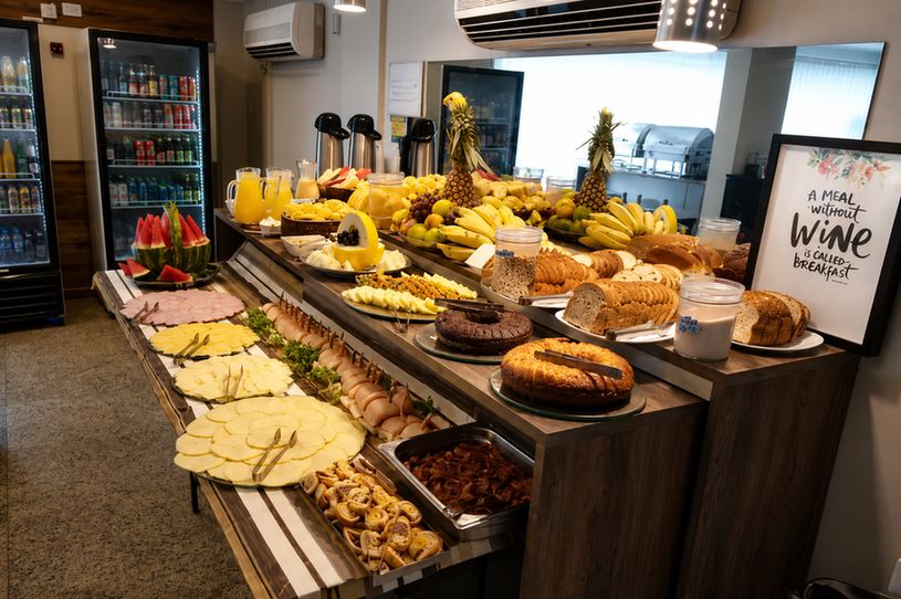 Continental breakfast with bread, homemade cake, fruit, coffee and juice